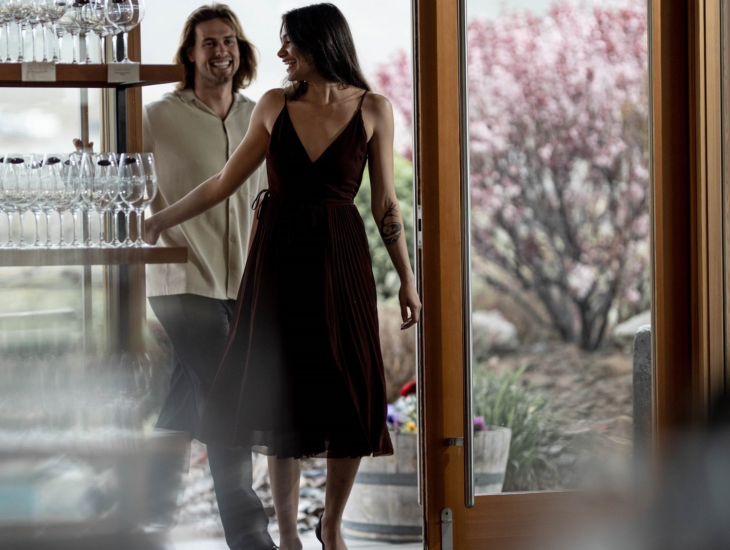 couple in doorway walking into black hills estate tasting room