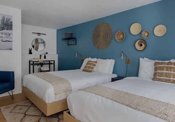 kettle valley beach resort double queen room - 2 queen beds, blue accent wall, neutral linens and colors