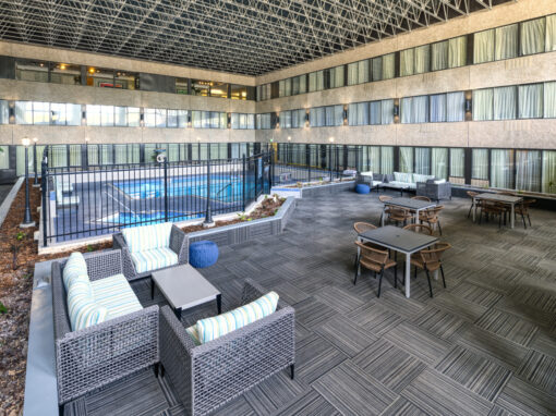 sandman hotel pool are with carpeting and seating
