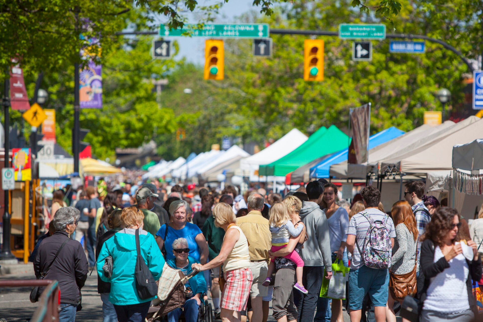 Busy Downtown Penticton Community Market with plenty of shoppers outside