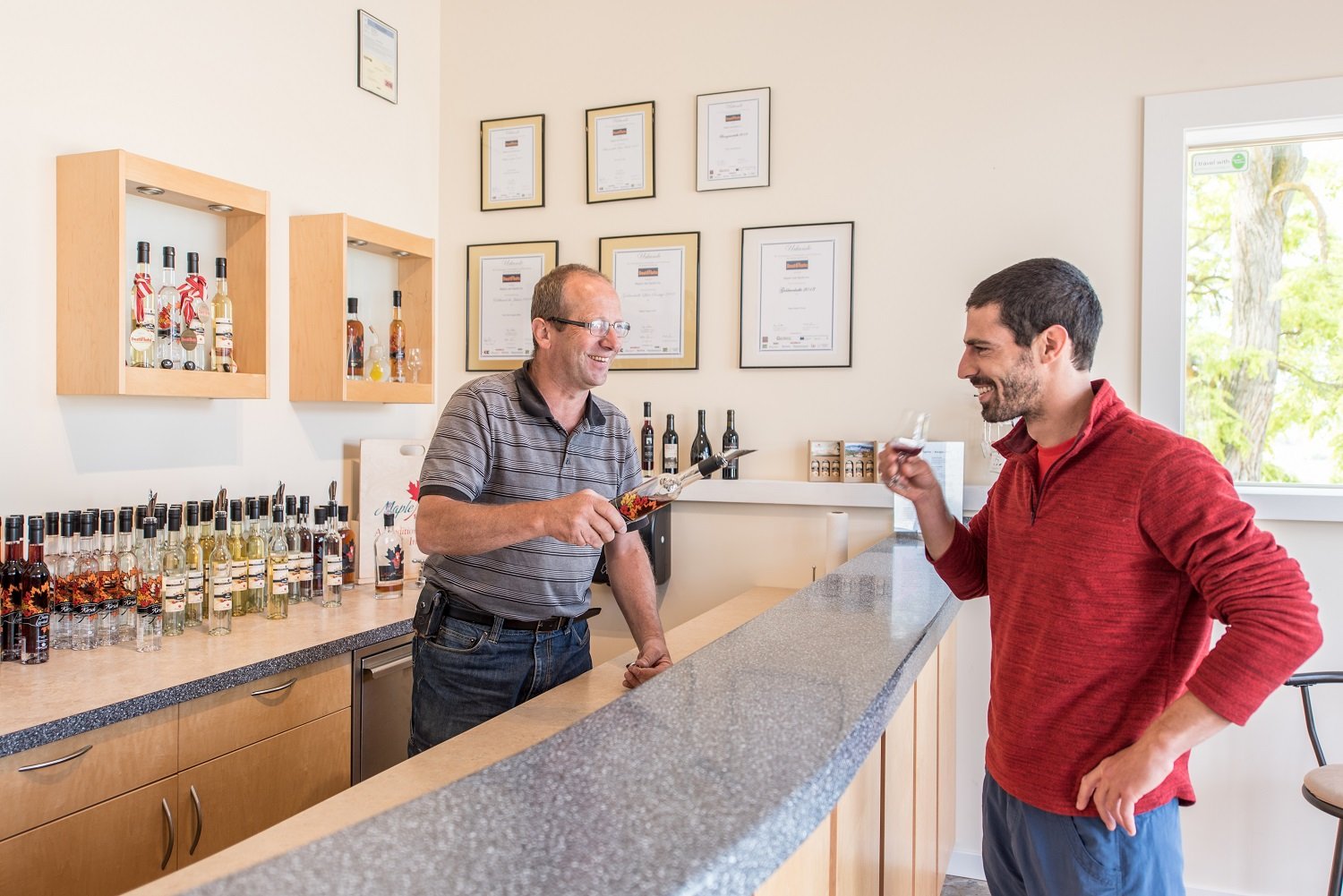 jorg at maple leaf spirits doing a tasting with a guest