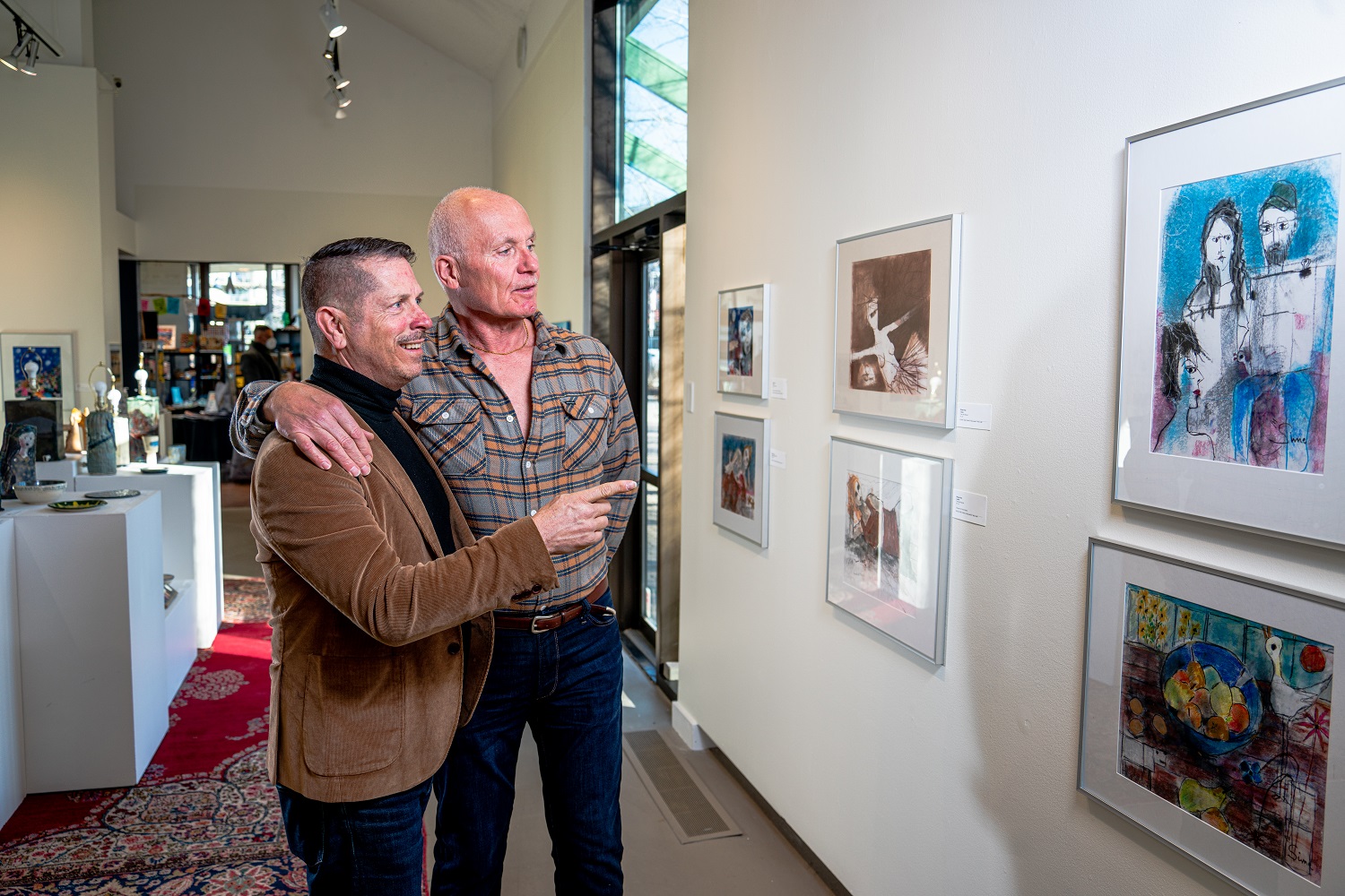couple browsing art at the penticton art gallery