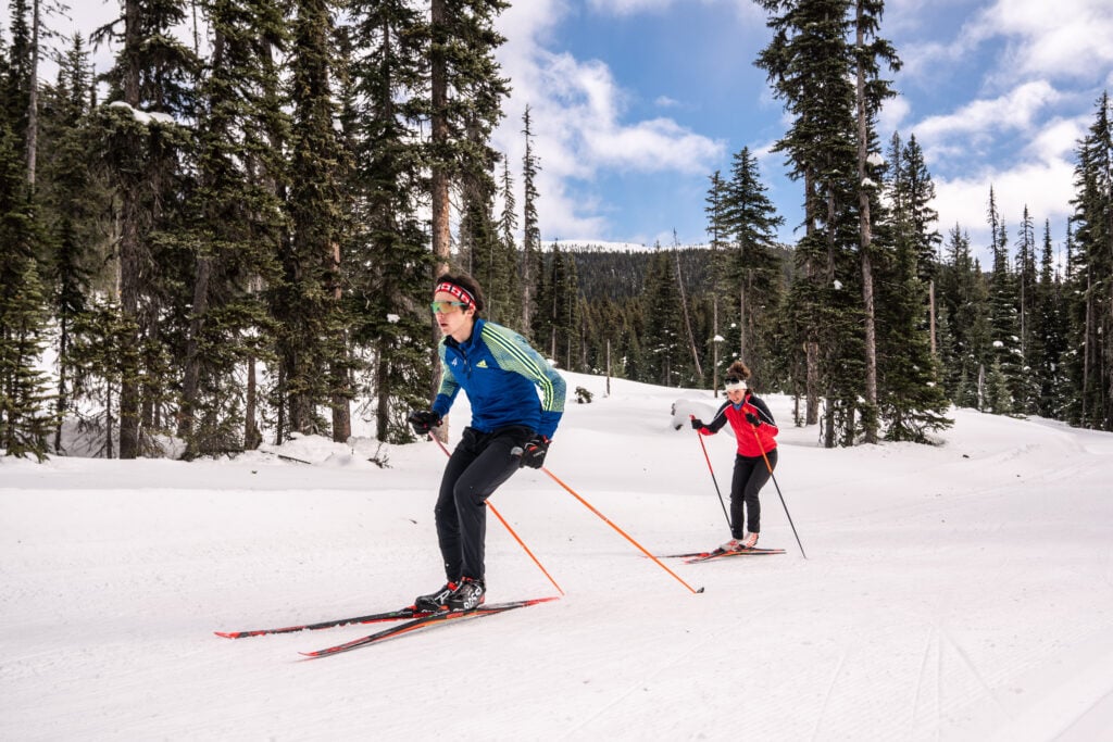 Man and woman cross country skiing during the day at Nickel Plate Nordic Centre