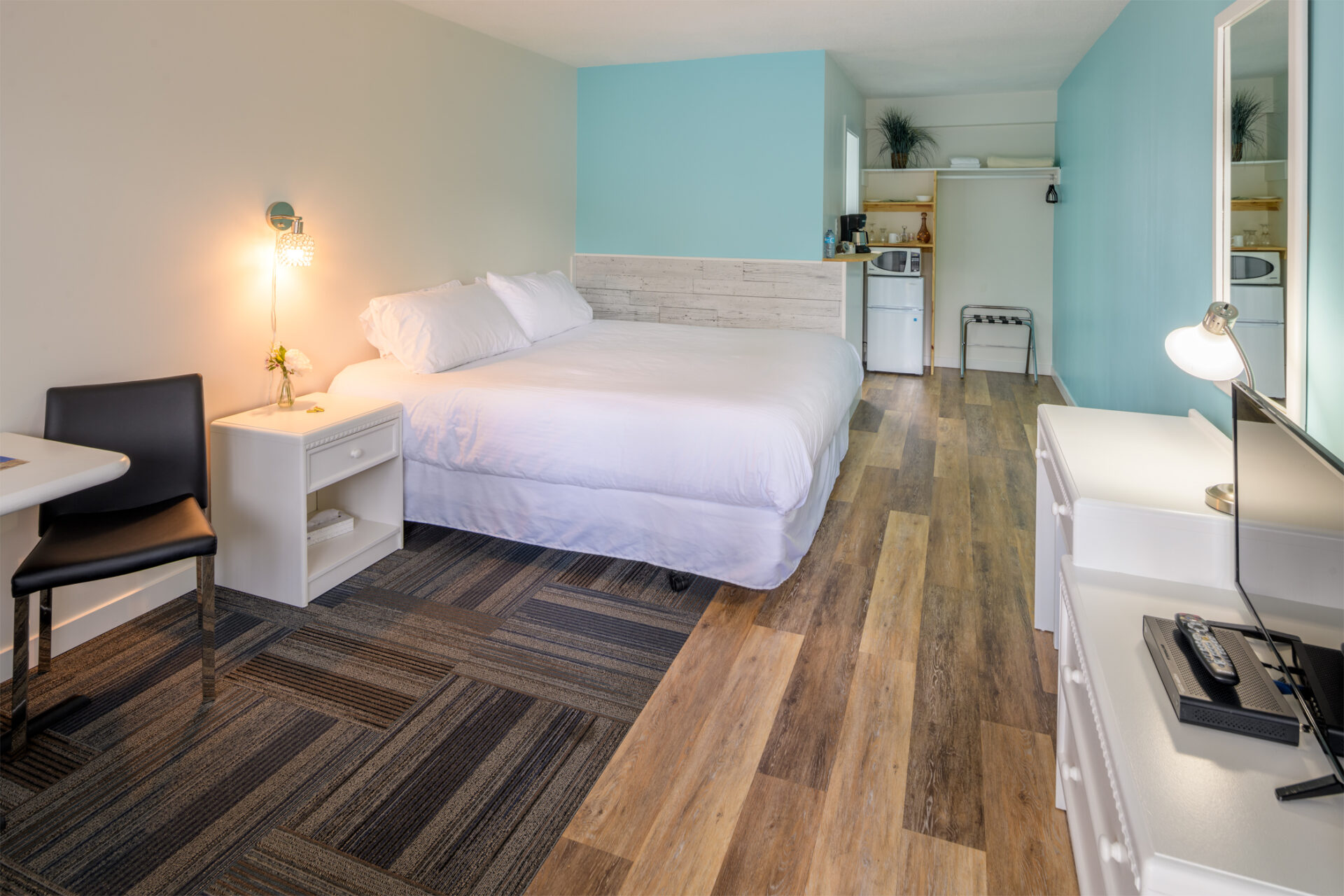 okanagan lakefront resort studio suite with blue accent walls, white furniture