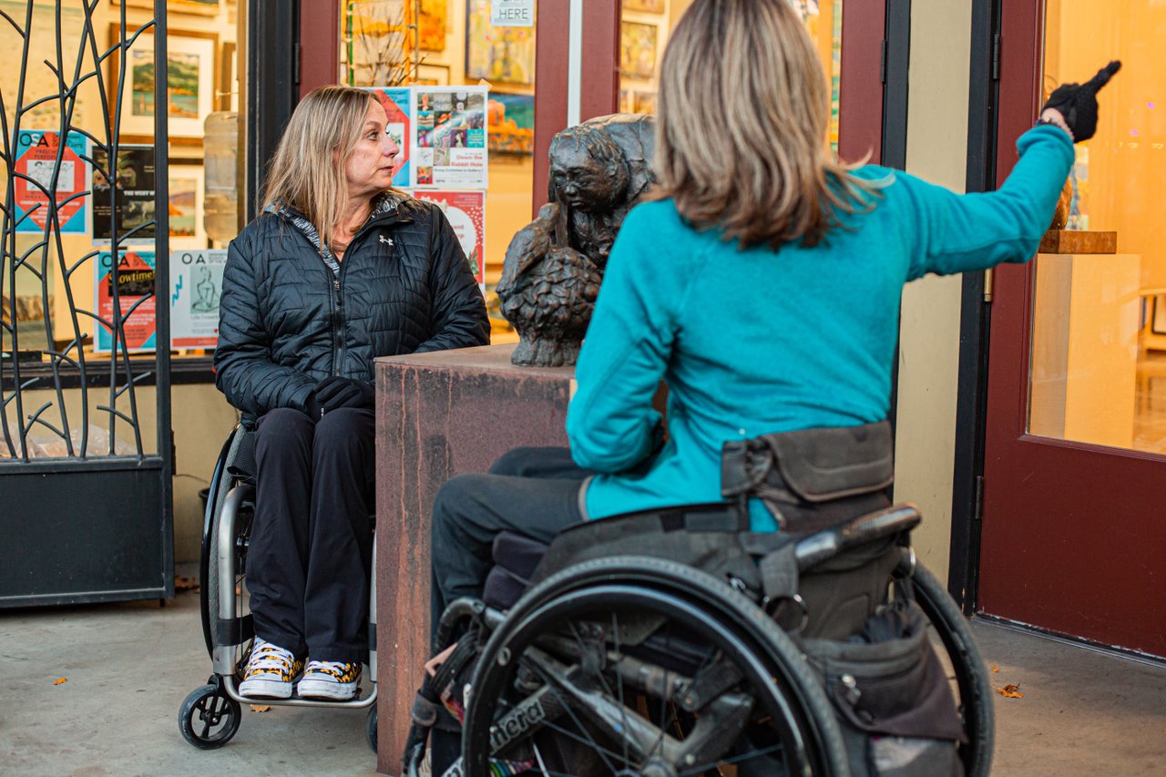 Accessible Tourism - checking out local Penticton art on front street
