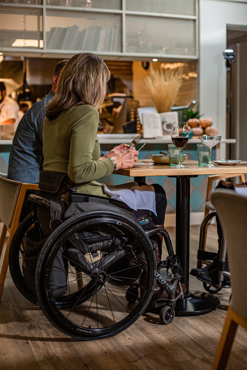 Accessible Tourism - wheelchair user dining at Elma Restaurant in Penticton