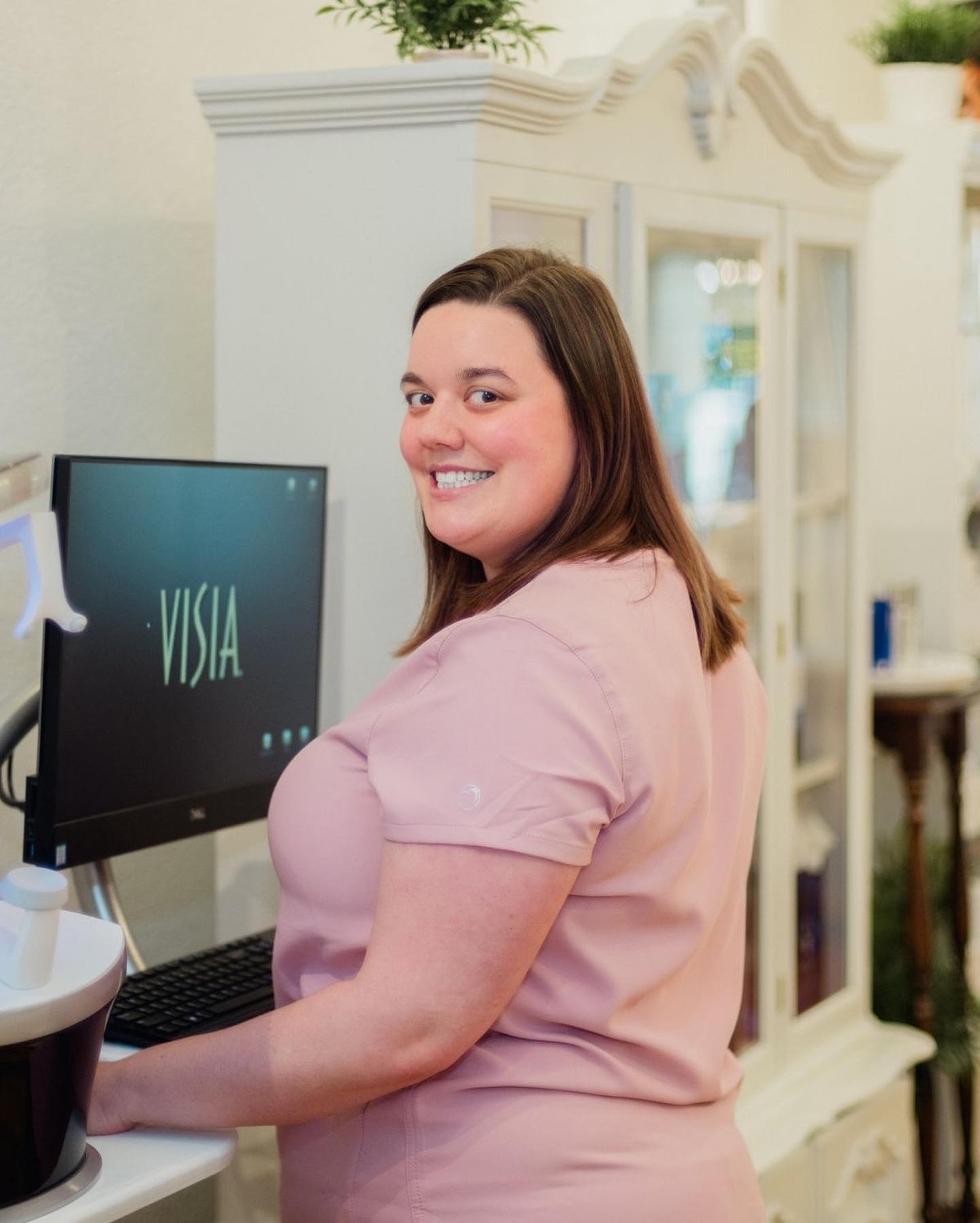 Staff on computer at La Creme de la Creme Skincare and Boutique