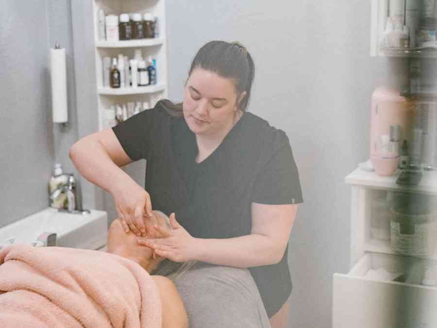 Megan Lindow performing a facial treatment in La Crème Skincare Boutique, Penticton BC