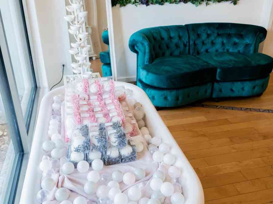 Front window seating area and bath bomb tub display a La Crème Skincare Boutique