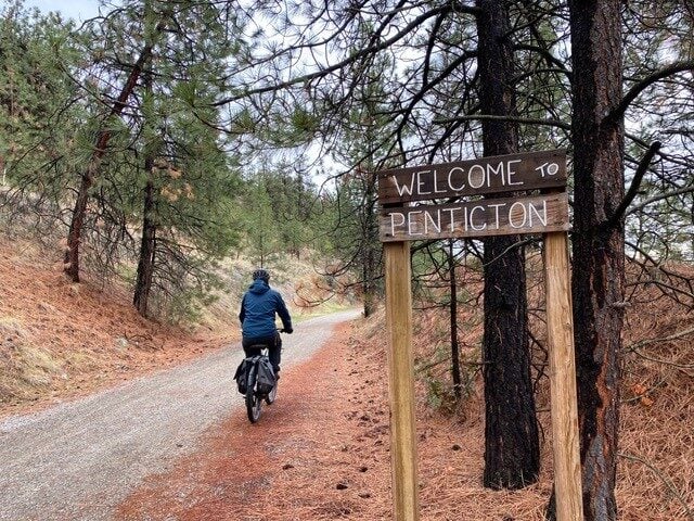 welcome to penticton sign as you bike along the kvr trail from naramata back into penticton