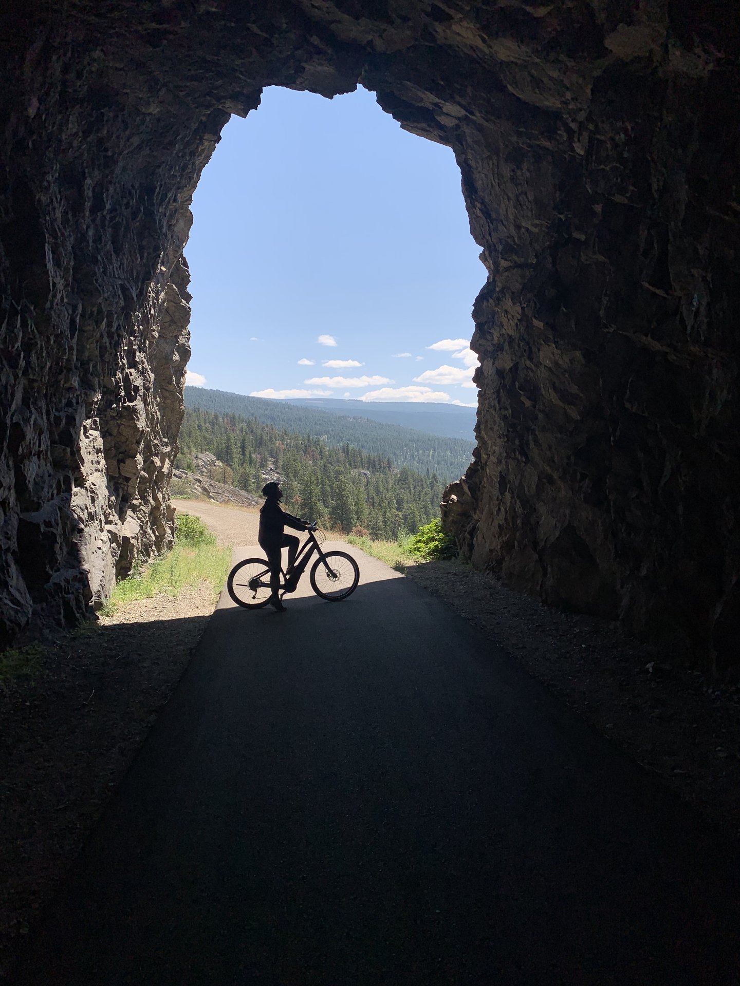 sitting on a bik inside the little tunnel above narmata on the kvr trail