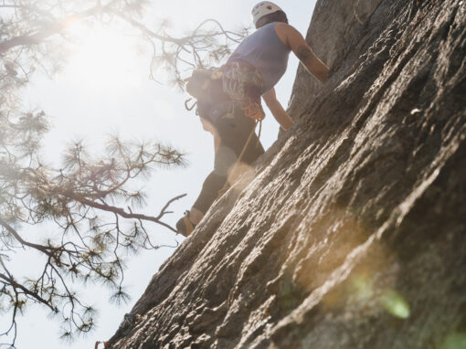 climber on the rocks in the sunshine at skaha bluffs