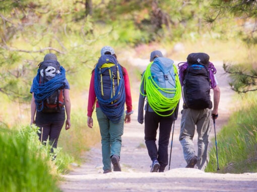 climbers hiking into the skaha bluffs