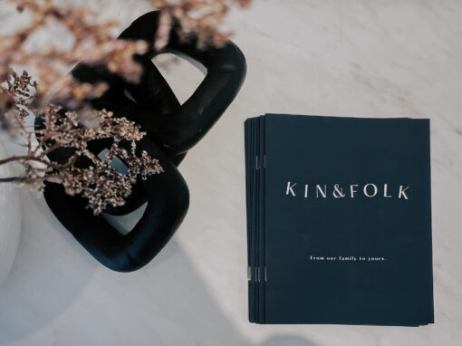 kin & folk restaurant black menus on a table