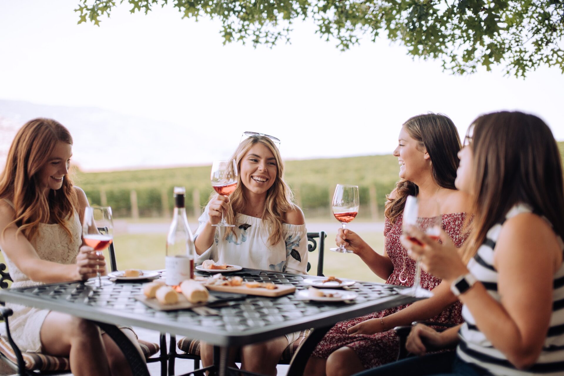 Hester Creek friends on patio with wine