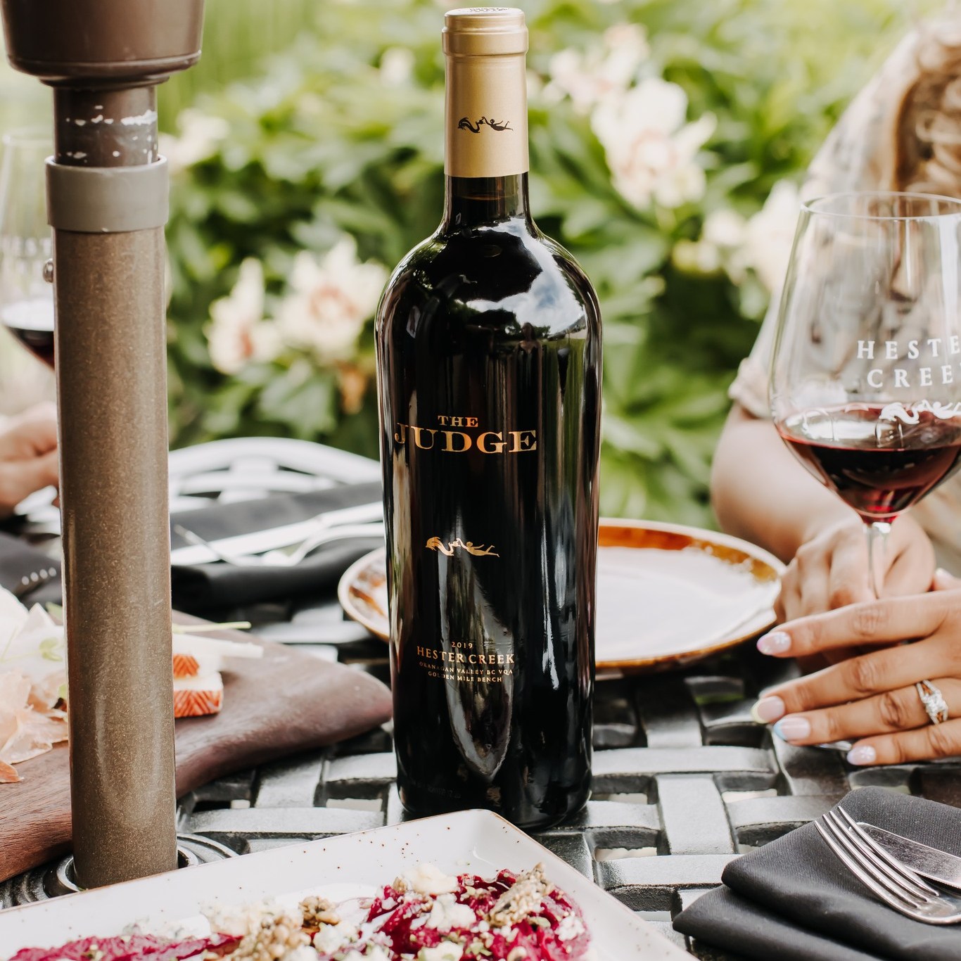 Hester Creek patio table with wine