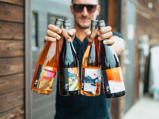 person holding 4 bottles of roche wines