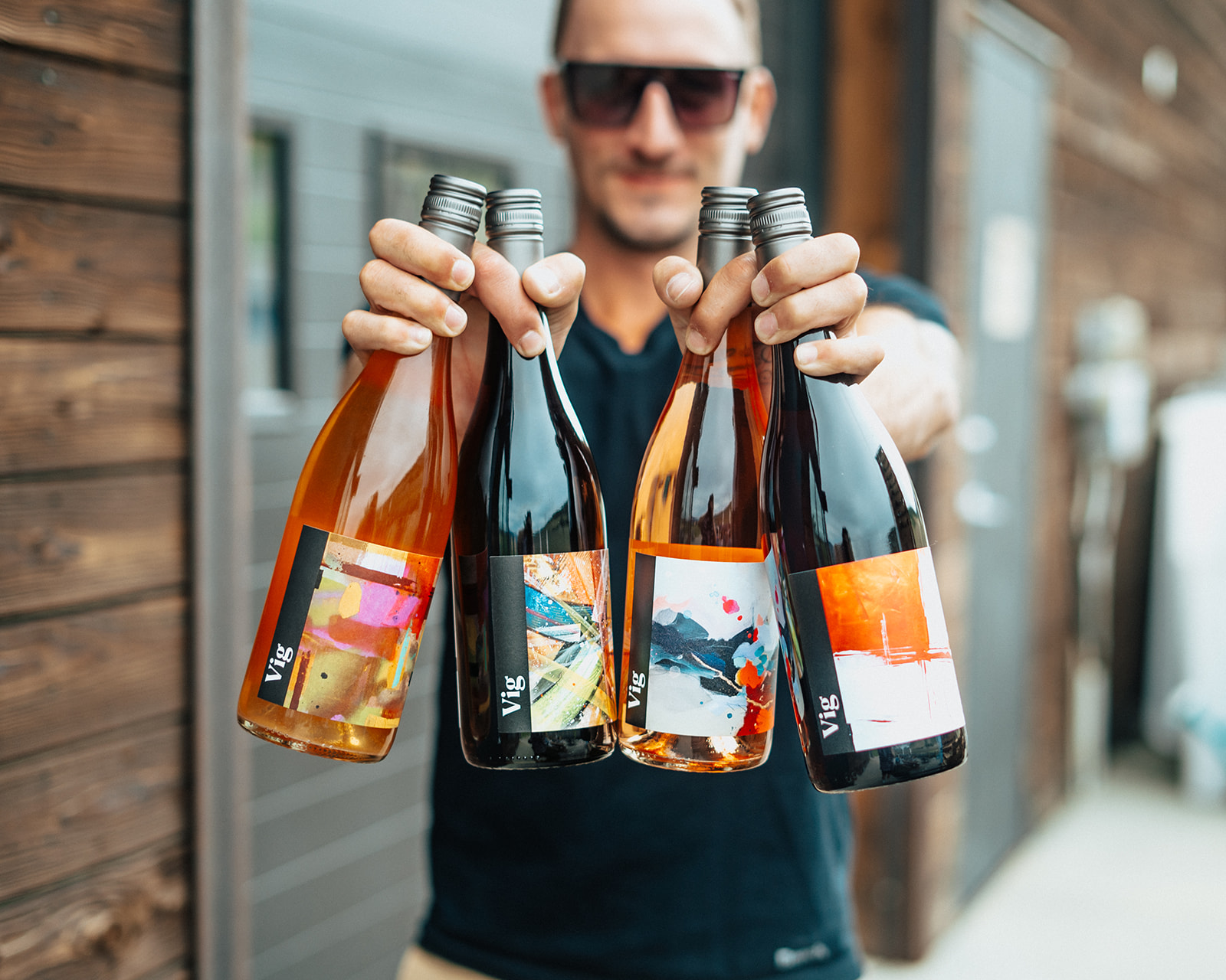 person holding 4 bottles of roche wines