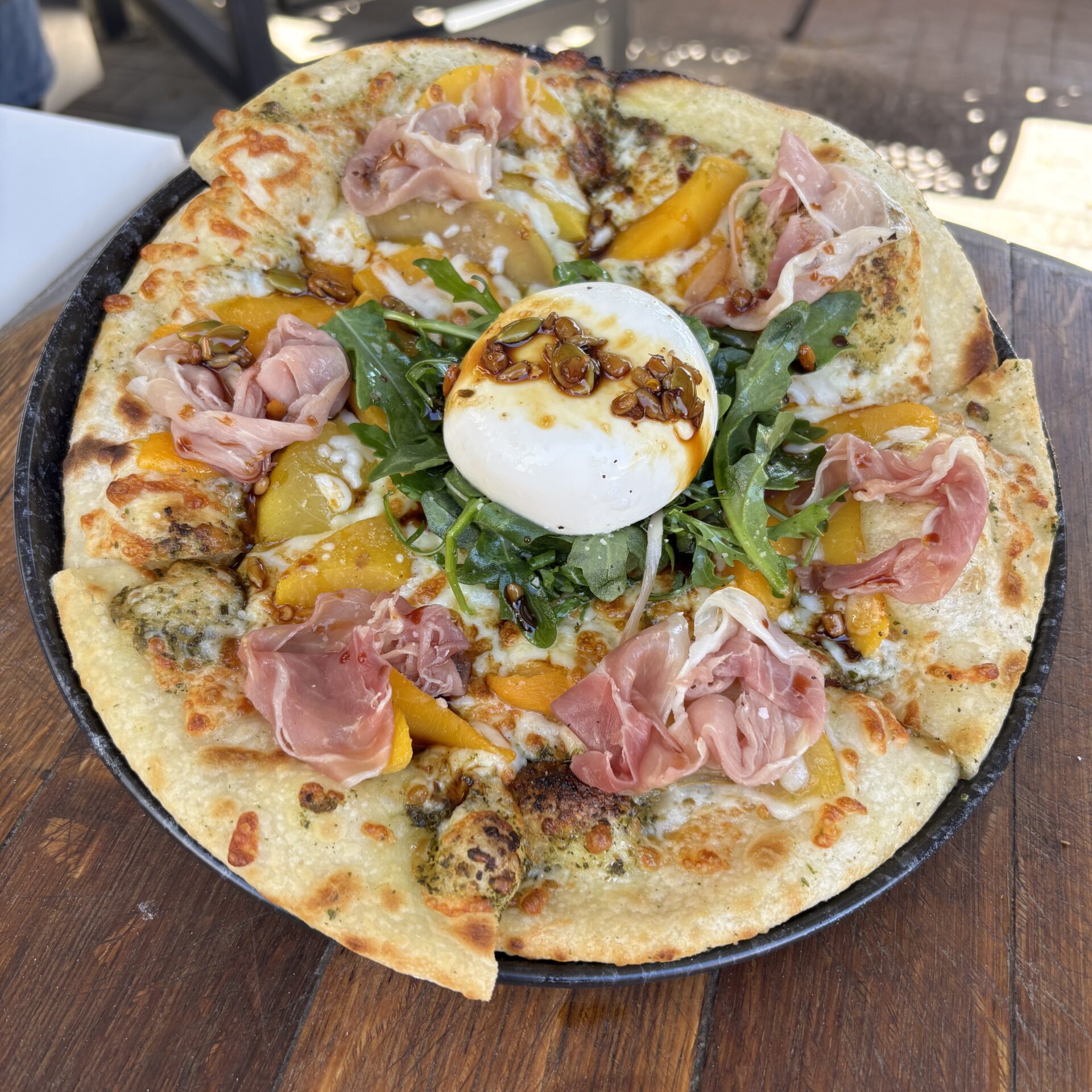 Sweetgrass at Nk'Mip Cellars' Peach & Prosciutto Flatbread